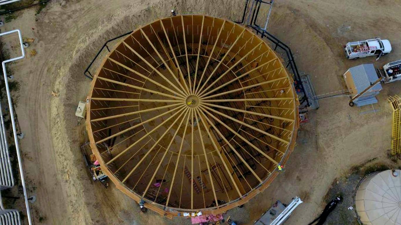 Field-erected steel tank engineered to meet API 12B standards for oil and gas storage applications.