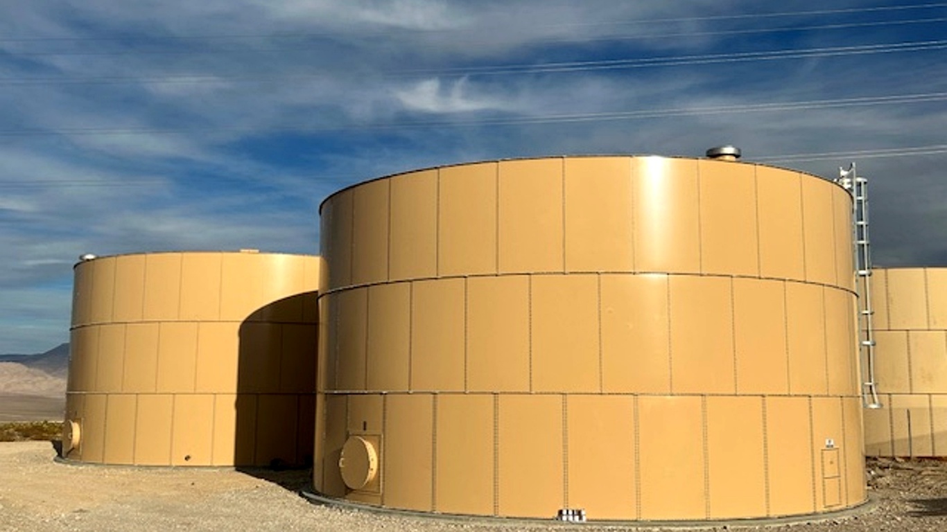 Bolted steel storage tanks installed at industrial site with modular panel construction